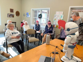 older adults watching a robot